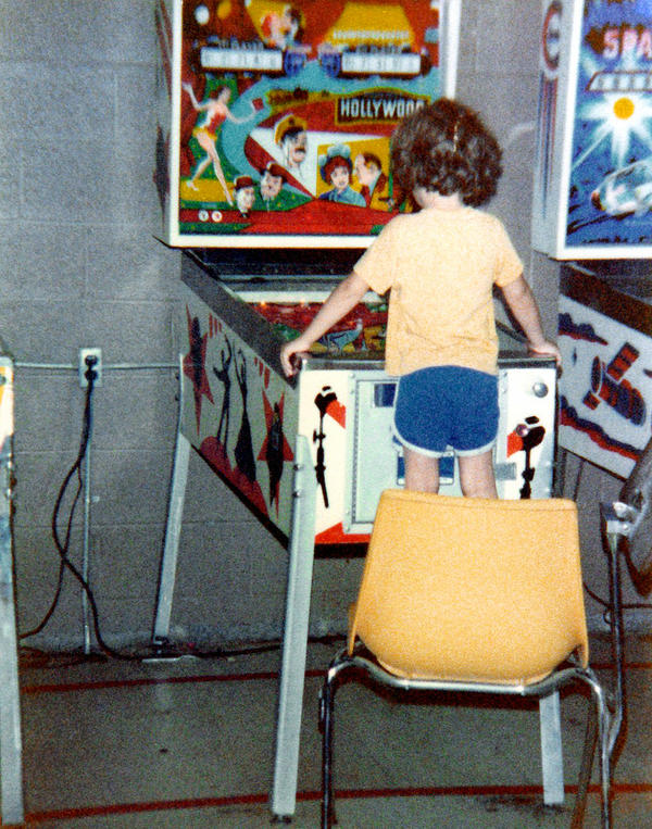 1979ish-clint-playing-pinball-by-dad_l