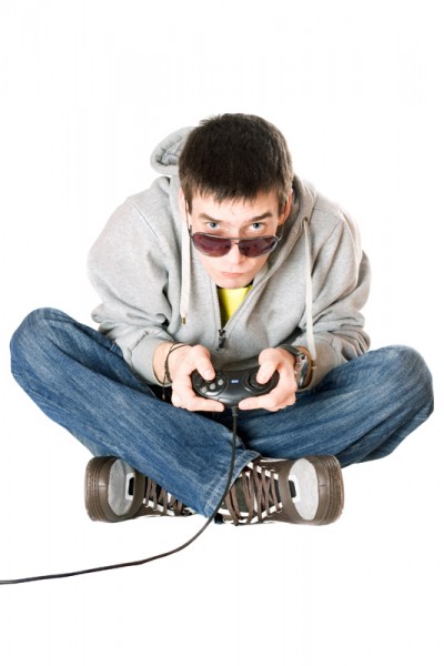 Young man in sunglasses with a joystick