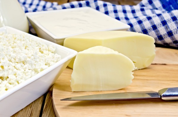 Cheese suluguni with curd and sour cream on board