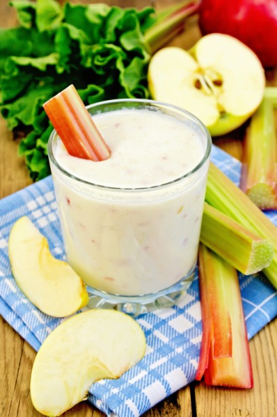 Milk cocktail with rhubarb and apples on the board