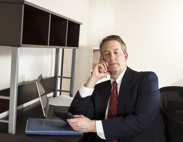 Mature Man Sleeps at Work