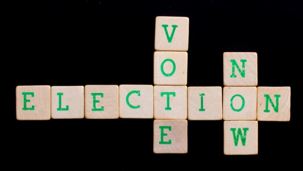Letters on wooden blocks (vote, elaction, now)