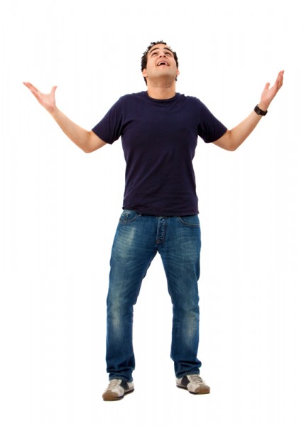 Casual happy man looking up with opened arms isolated on white