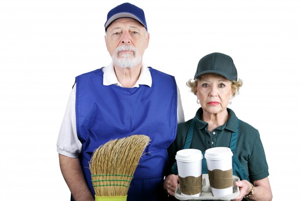 A senior couple stuck in boring service jobs because they can't afford retirement.  Isolated on white.