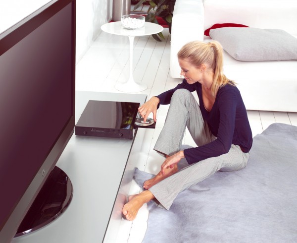 woman using dvd player