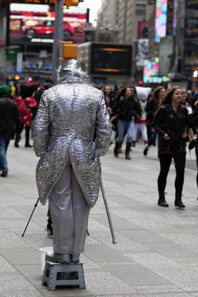 New York City, USA - March 18, 2015: Costumed street character performers on the streets of New York City on March 18, 2015. Costumed characters who pose for pictures with tourists in Times Square could become regulated under a proposed New York City law. If passed, the bill would require anyone who alters their appearance with costumes, makeup, wigs, or other methods and seeks money to go through a registration process, complete a background check, and wear identification visible on their person while in character.