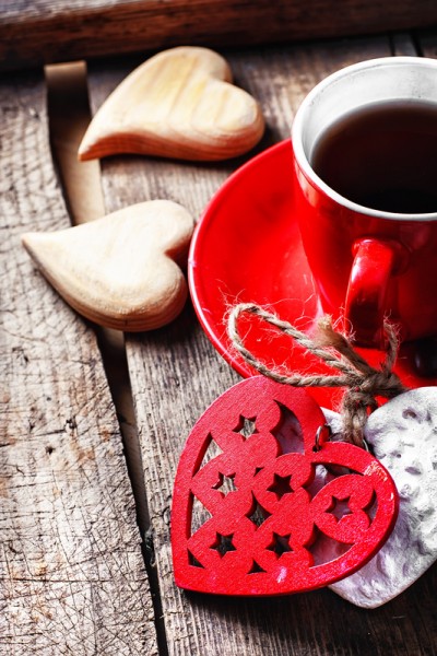 Cup decorated with wooden hearts