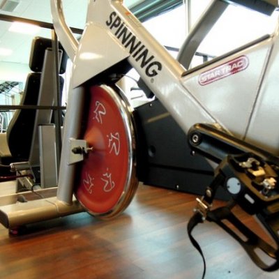 Flywheels, Pedals and Friction: Spin Bike Shopping and Specifications Simplified